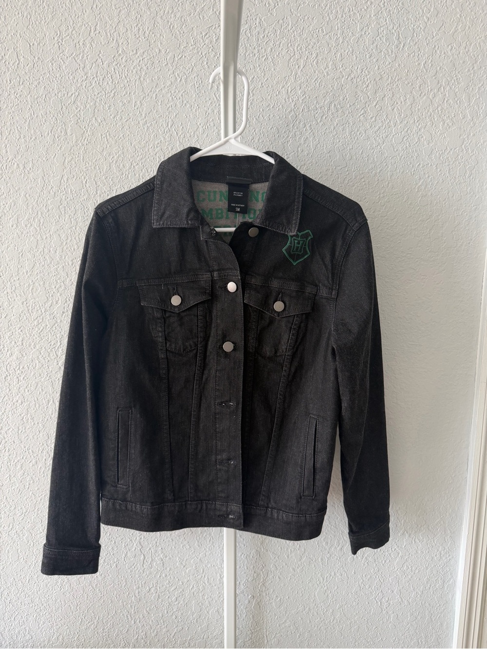 Harry Potter’s Black Denim Jean Jacket with Green Crest Slytherin house.